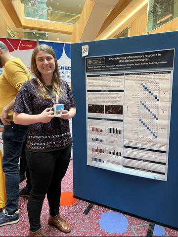 A photograph of Helen Rowland with her poster. A photograph of Helen Rowland with her poster.