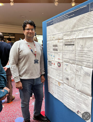 A photograph of Manish Singh Kushwah with his poster. A photograph of Manish Singh Kushwah with his poster.